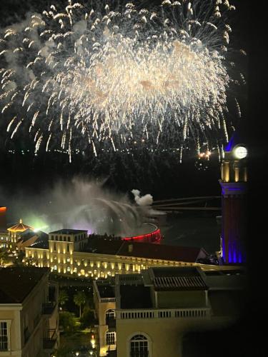a firework display in the sky over a city at Oscar Seaview Apartment in Phu Quoc