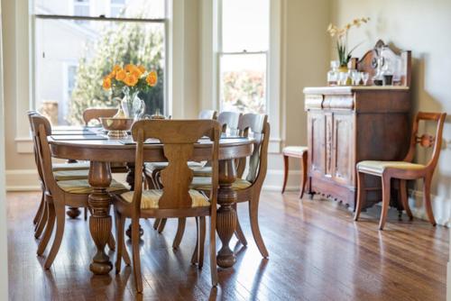 a dining room with a wooden table and chairs at Clifton House - Big River South - Mississippi River Views, Queen Suite in Natchez