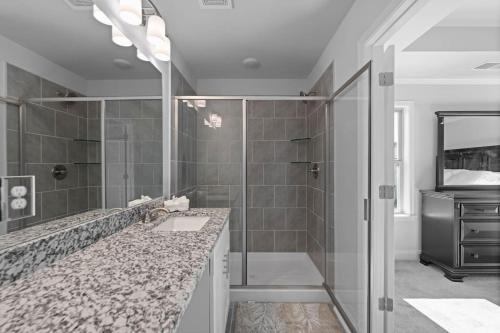 a bathroom with a sink and a shower at The Arches in Lawrenceville
