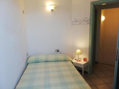 Postel nebo postele na pokoji v ubytování Confortevole Trilocale con Vista Mare a San Pasquale, Sardegna