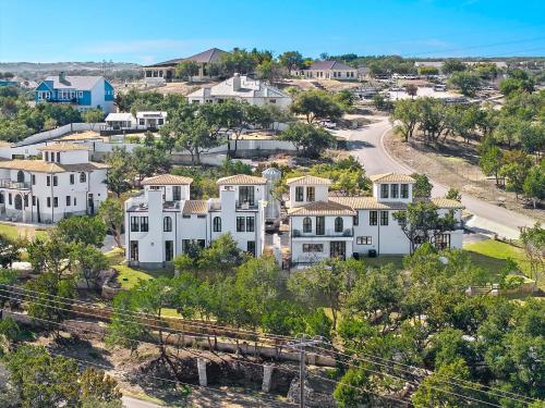 an aerial view of a neighborhood with white houses at Las Luces in Spicewood