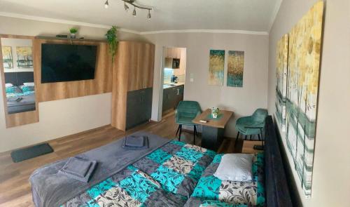 Postel nebo postele na pokoji v ubytování Spengler Apartman
