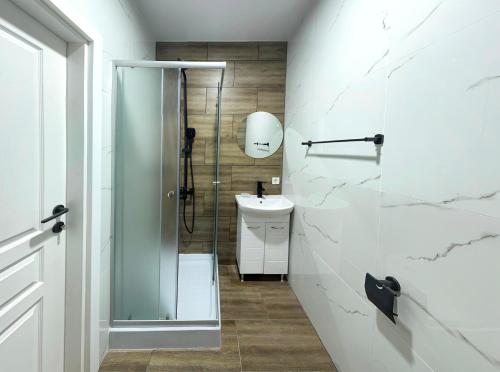 a bathroom with a shower and a sink at Hotel Yo in St. St. Constantine and Helena