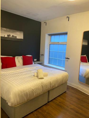a bedroom with a large bed with a window at Parliament Inn in Kilkenny