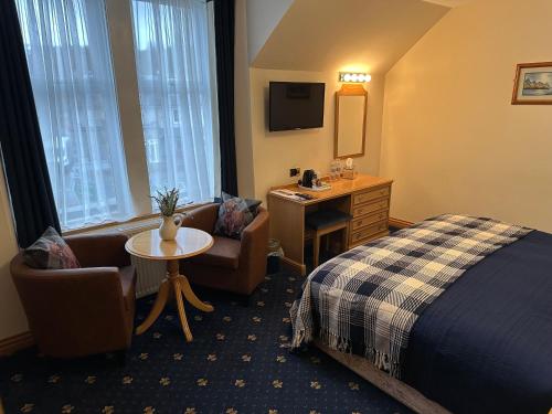Postel nebo postele na pokoji v ubytování The Glen Hotel Newtonmore