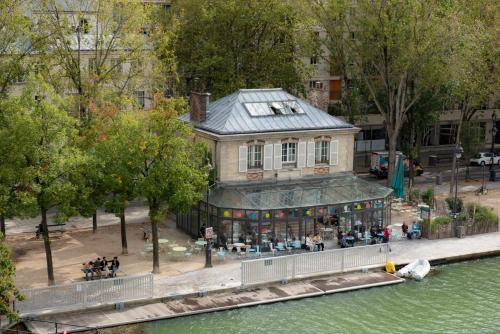 an overhead view of a building next to a river at Holiday Inn Express Paris-Canal De La Villette by IHG in Paris