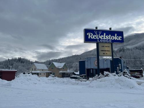 a sign for a rexknife lodge in the snow at Revelstoke Lodge in Revelstoke