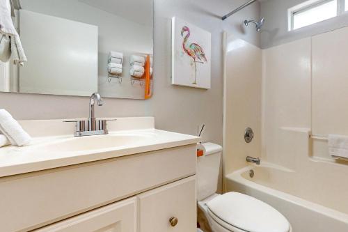 a bathroom with a sink and a toilet at Leeward 9303 in Padre Island