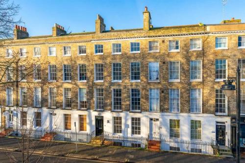 a large brick building with white doors and windows at 3 The Steyne - Stunning 5 Storey Georgian house with cinema room in Worthing