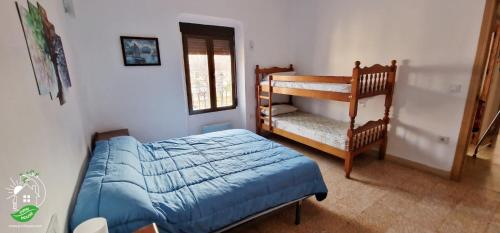 Ένα ή περισσότερα κρεβάτια σε δωμάτιο στο Pirri House Letur