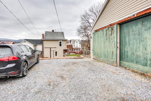 a car parked in a parking lot next to a building at Family-Friendly Altoona Abode with Spacious Patio! in Altoona