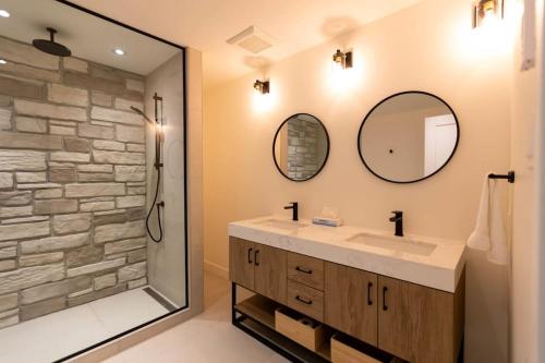 a bathroom with a sink and a mirror at Perché Private Hot Tub Pool Table Peaceful in Brownsburg