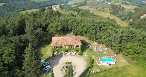 an aerial view of a house with a swimming pool at Villa Albertina in Montespertoli