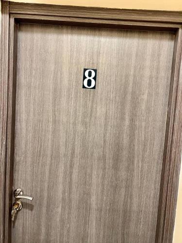 a metal door with the number eight on it at MAMA,3 min à la plage10 min à la médina in Essaouira