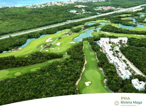 an aerial view of the golf course at a resort at Akumal Heaven Beach Access 7 Rooftop Pools W Caribbean Sea Views + Beach Club in Akumal