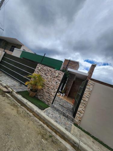 a house with a staircase in front of it at Seguridad con buen ambiente in Concepción de La Vega
