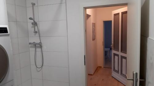 a bathroom with a shower with a glass door at Wohnung für 6 Personen in Gevelsberg in Gevelsberg