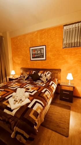 a hotel room with a bed with towels on it at HGA-Perla-Spa in La Paz