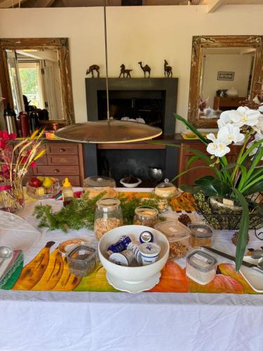 a table with food and other items on it at Pousada Boutique Itaipava in Itaipava