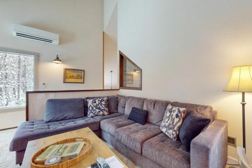 a living room with a couch and a table at Golf Home 155 in Black Butte Ranch