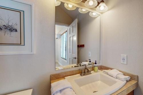 a bathroom with a sink and a mirror at Golf Home 155 in Black Butte Ranch