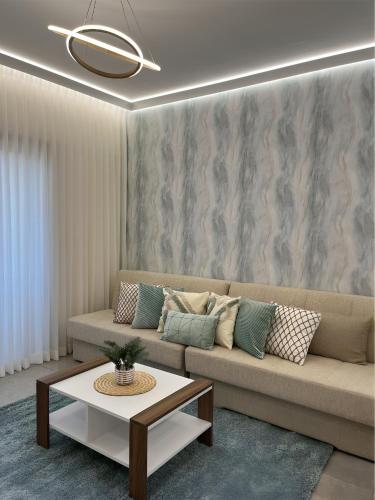 a living room with a couch and a coffee table at Jerusalem Center in Jerusalem