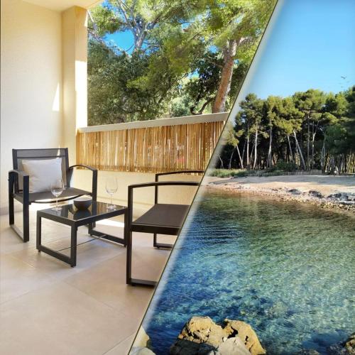 - une piscine avec une table et des chaises à côté de la piscine dans l'établissement Studio Le Provençal proche plage, à Saint-Mandrier-sur-Mer