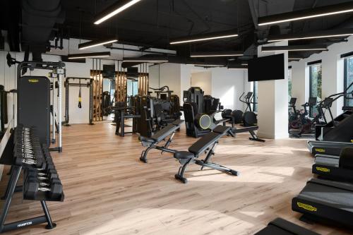 a gym with several treadmills and exercise machines at Loews Nashville Hotel at Vanderbilt Plaza in Nashville