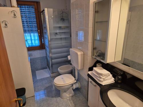 a bathroom with a toilet and a sink at Miriam House Florence - full apartment - relax & comfort in Florence