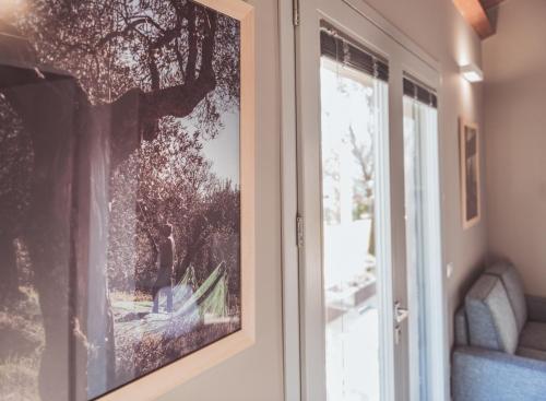 a picture hanging on a wall next to a door at Agriturismo Querceto in Frazione Mocaiana