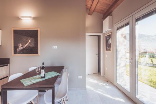 a dining room with a table and chairs and a window at Agriturismo Querceto in Frazione Mocaiana