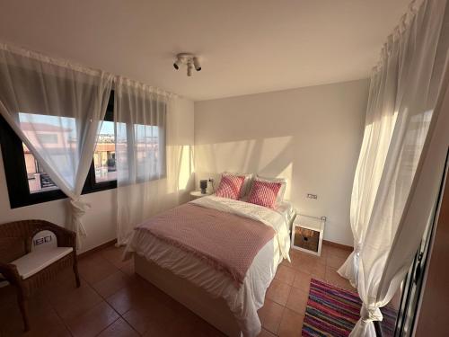 En eller flere senge i et værelse på El Rincón de Carmen