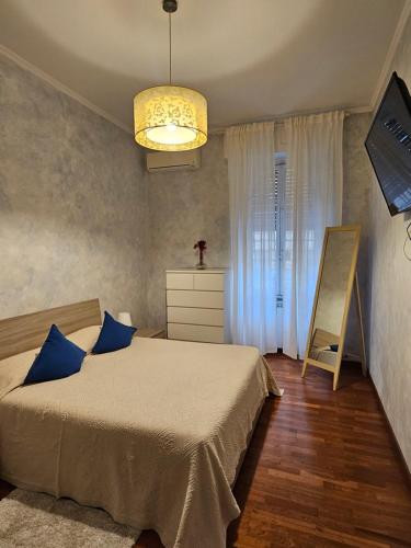 Ένα ή περισσότερα κρεβάτια σε δωμάτιο στο Cocò Home Tranquil oasis in Trastevere