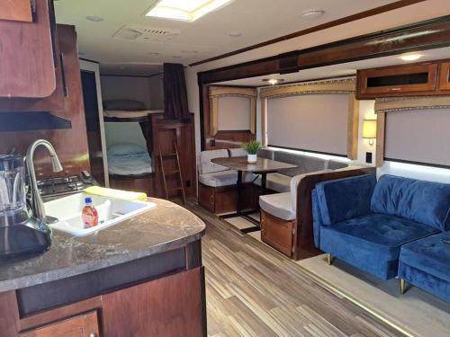 a kitchen and living room of an rv at Sunset Trailer Park RV # 2 in El Suazal