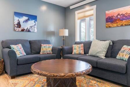 a living room with a couch and a coffee table at Teton Crest Lodge Sleeps 24 Ideal Reunion Spot in Driggs