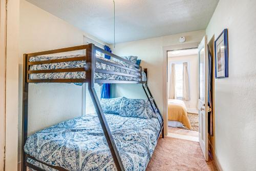 a bedroom with two bunk beds in a room at Close to Casinos and Trails Historic Victor Cottage in Victor