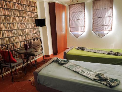 Un pat sau paturi într-o cameră la Hammam Antistress