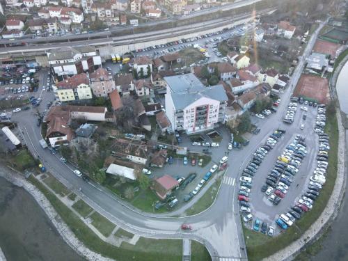 an aerial view of a parking lot with cars at City Center Apartment Uzice in Užice