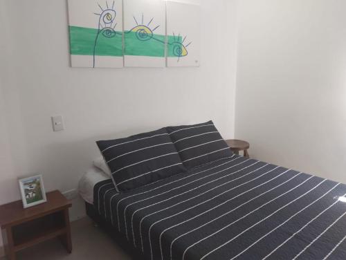 En eller flere senger på et rom på APARTAMENTO LIVING en La CEJA