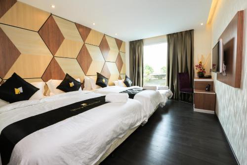Postel nebo postele na pokoji v ubytování Mercury Boutique Hotel