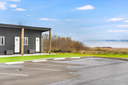 a parking lot in front of a building at South Bay Inn in Westport