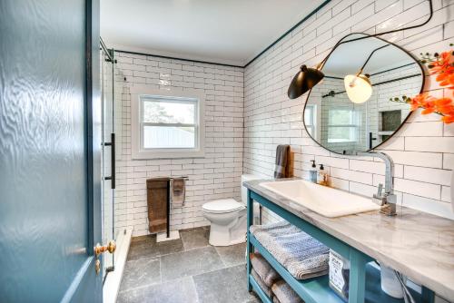 a bathroom with a sink and a mirror at Virginia Retreat with Porch and Grill, Near Beaches! in Wachapreague