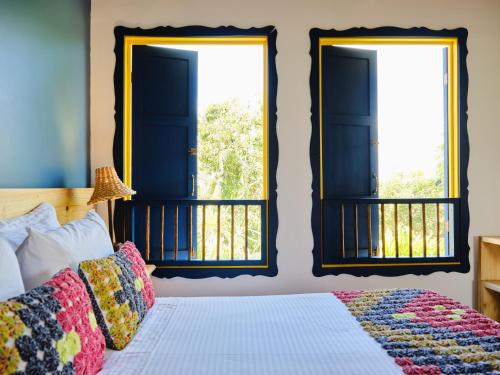 Una cama o camas en una habitación de Hotel Hacienda Combia