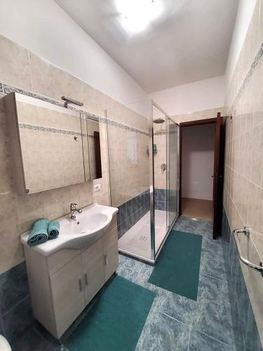 a bathroom with a sink and a shower at CASA ROSELLINA SORRENTO in Sorrento