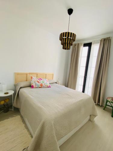 En eller flere senge i et værelse på Apartamento La Parra