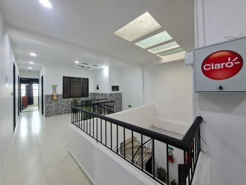 a hallway of a hospital with a sign on the wall at Hotel colina del meta in Villavicencio
