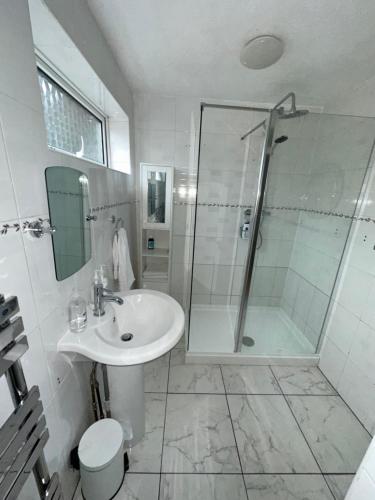 a bathroom with a sink and a shower at Pendleton Valley in Peterborough