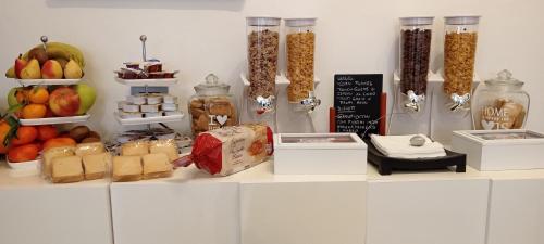 a counter with fruits and vegetables and other food items at G&G Giusy e Gabry in Santhià