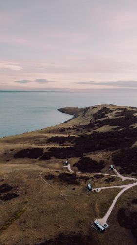 an aerial view of an island with the ocean at CABN Kangaroo Island in Penneshaw