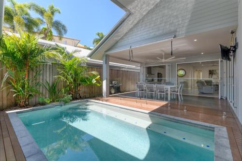 an image of a swimming pool in a house at Luxury Retreat on Mudlo, 4 bedroom home with pool in Port Douglas